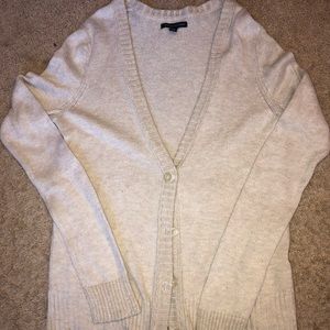 Beige cardigan sweater.